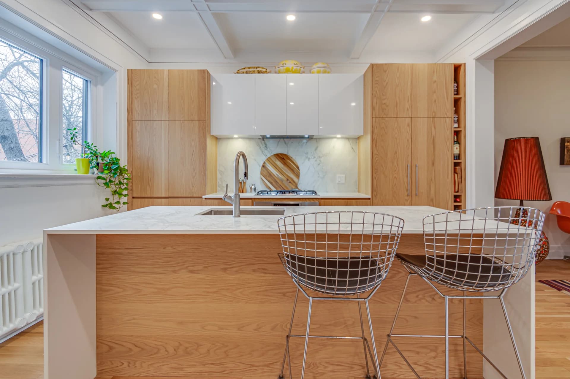 Bright kitchen with a wooden island and cabinetry